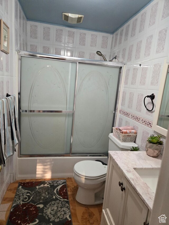 136 S 200 W, Wellsville, UT 84339 - full bathroom with bath / shower combo with glass door, vanity, and toilet