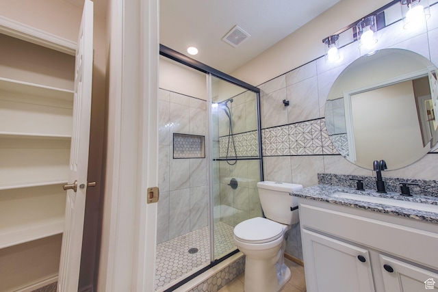 1279 W Culloden Ct, Murray, UT 84123 - bathroom featuring toilet, a stall shower, vanity, and visible vents