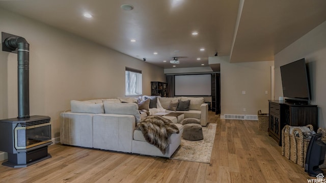 1336 Antibe Ln, Midway, UT 84049 - cinema with light hardwood / wood-style flooring and a wood stove