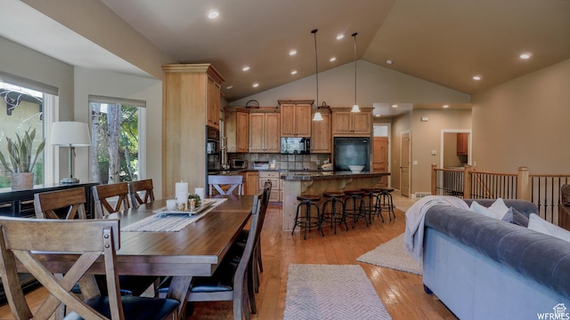 1336 Antibe Ln, Midway, UT 84049 - dining area with high vaulted ceiling and light wood-type flooring