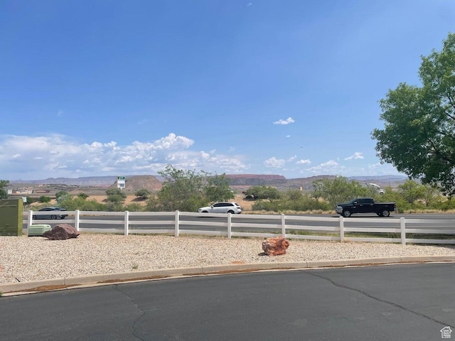 1150 W Red Hills Pkwy # 1, Washington, UT 84780 - view of yard with fence and a mountain view