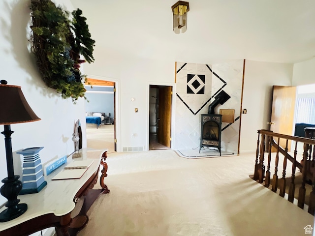 588 W Raspberry Patch Rd, Garden City, UT 84028 - carpeted bedroom with visible vents and a wood stove