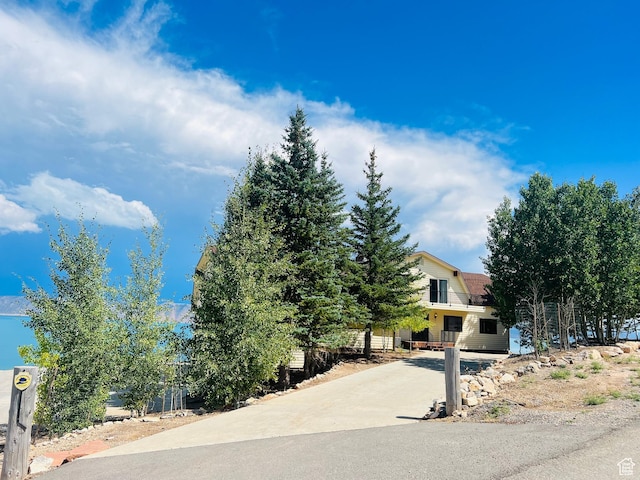588 W Raspberry Patch Rd, Garden City, UT 84028 - exterior space with a gambrel roof and roof with shingles