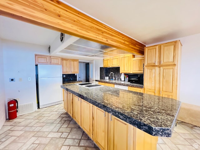 588 W Raspberry Patch Rd, Garden City, UT 84028 - kitchen with light brown cabinets, beam ceiling, white appliances, and tile counters