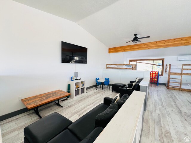 588 W Raspberry Patch Rd, Garden City, UT 84028 - living room with ceiling fan, baseboards, vaulted ceiling, light wood-style floors, and a wall mounted AC