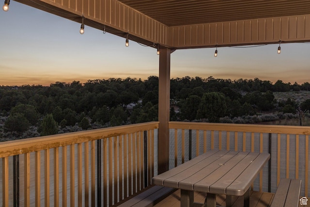 wooden terrace with outdoor dining space