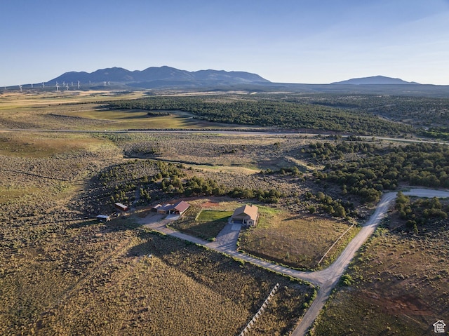 drone / aerial view featuring a rural view and a mountain view
