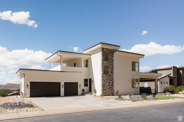 445 N 250 E, La Verkin, UT 84745 - modern home with stucco siding, concrete driveway, stone siding, and a garage