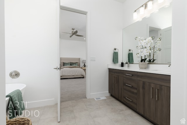 bathroom featuring vanity, tile patterned flooring, and ceiling fan