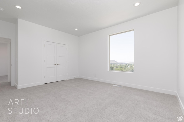 445 N 250 E, La Verkin, UT 84745 - unfurnished bedroom featuring light colored carpet, recessed lighting, baseboards, and a closet