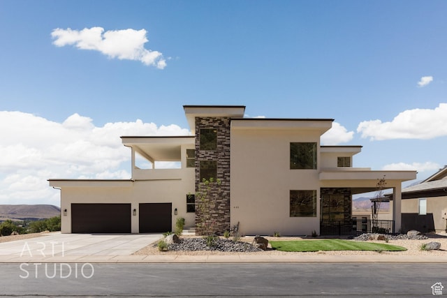 445 N 250 E, La Verkin, UT 84745 - contemporary house with stucco siding, driveway, an attached garage, and stone siding