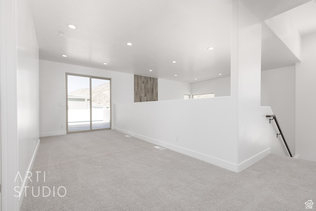 spare room with light carpet