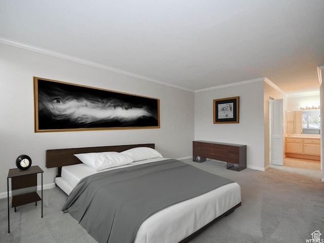 bedroom featuring carpet floors, baseboards, ornamental molding, and connected bathroom