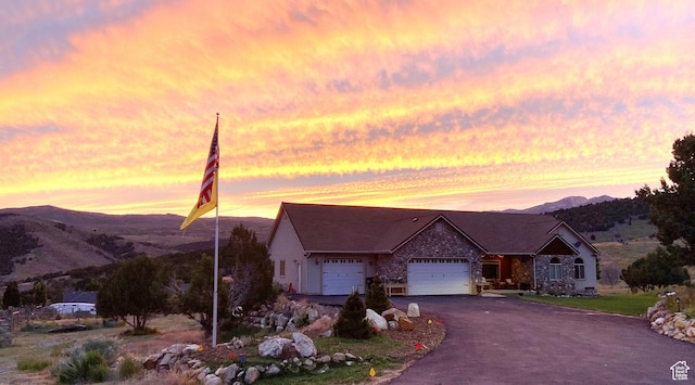 19638 S Buckskin Cir, Birdseye, UT 84629 - single story home with a mountain view, a garage, driveway, and stone siding