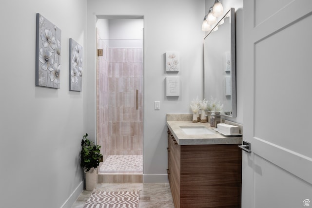 2596 S Gritton St, Hurricane, UT 84737 - bathroom with vanity, a shower stall, and baseboards