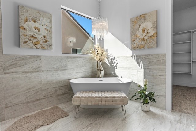 2596 S Gritton St, Hurricane, UT 84737 - full bath featuring a notable chandelier, tile walls, and a freestanding bath
