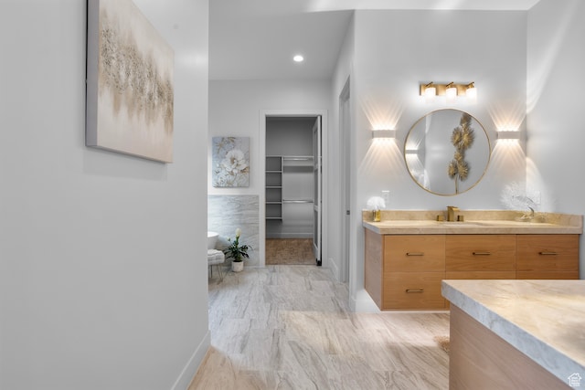 2596 S Gritton St, Hurricane, UT 84737 - bathroom featuring recessed lighting, baseboards, a spacious closet, and vanity