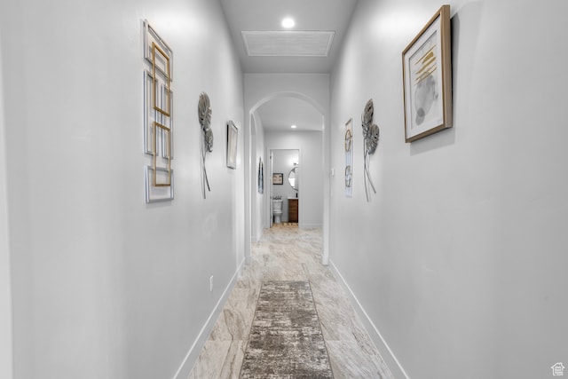2596 S Gritton St, Hurricane, UT 84737 - hallway featuring visible vents, arched walkways, marble finish floor, and baseboards