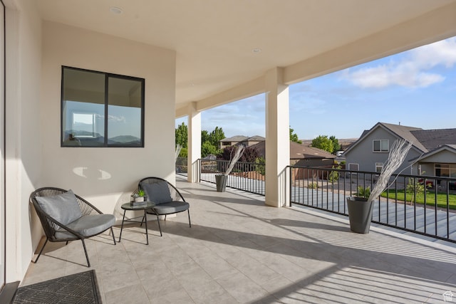 2596 S Gritton St, Hurricane, UT 84737 - view of patio featuring a balcony and a residential view
