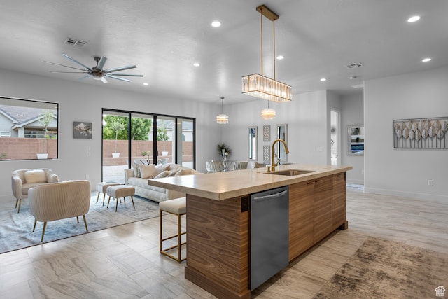2596 S Gritton St, Hurricane, UT 84737 - kitchen featuring visible vents, a sink, light countertops, stainless steel dishwasher, and open floor plan