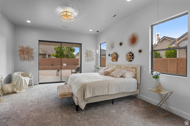 2596 S Gritton St, Hurricane, UT 84737 - bedroom with carpet flooring, multiple windows, baseboards, and access to outside