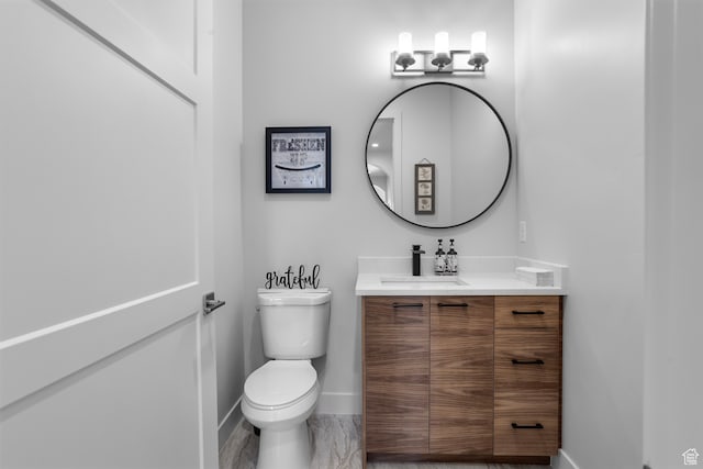 2596 S Gritton St, Hurricane, UT 84737 - half bath featuring toilet, vanity, and baseboards