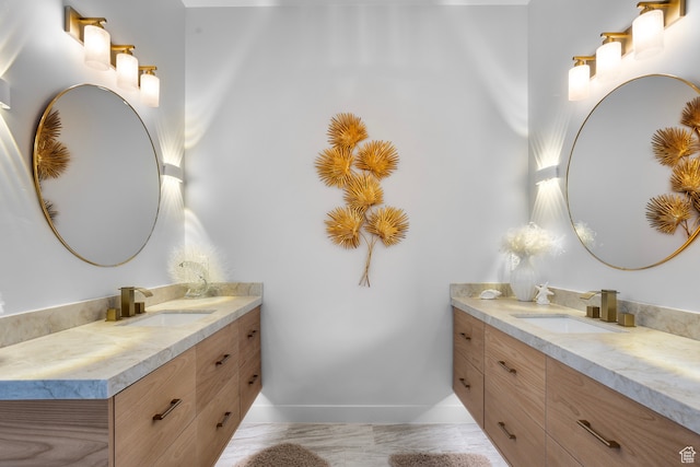 2596 S Gritton St, Hurricane, UT 84737 - full bathroom with two vanities, baseboards, and a sink