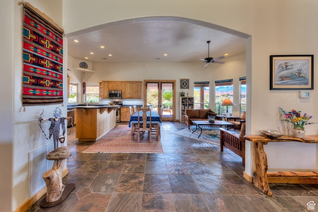 431 E Coronado Ln, Moab, UT 84532 - interior space with stone tile floors, recessed lighting, a ceiling fan, and arched walkways