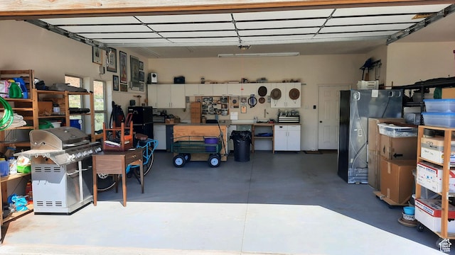 431 E Coronado Ln, Moab, UT 84532 - garage with a workshop area and freestanding refrigerator