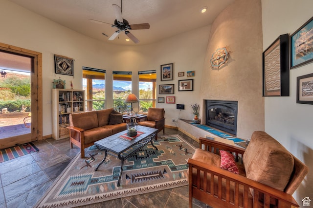431 E Coronado Ln, Moab, UT 84532 - living room featuring stone tile floors, baseboards, a fireplace, recessed lighting, and ceiling fan