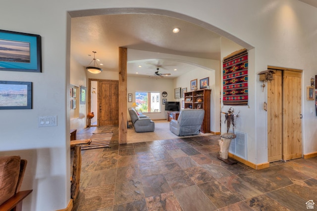 431 E Coronado Ln, Moab, UT 84532 - interior space featuring baseboards, ceiling fan, stone tile floors, recessed lighting, and arched walkways