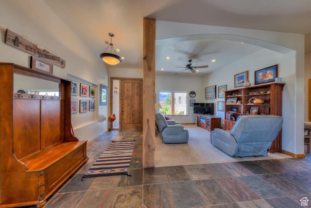 431 E Coronado Ln, Moab, UT 84532 - living area with baseboards, arched walkways, a ceiling fan, and stone finish floor