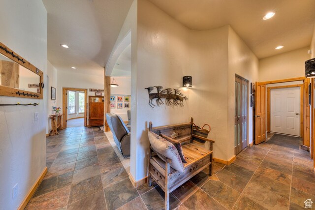 431 E Coronado Ln, Moab, UT 84532 - hallway with recessed lighting, baseboards, arched walkways, and stone finish floor
