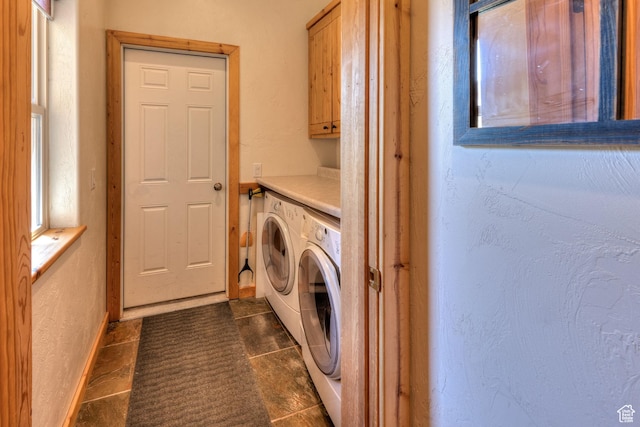 431 E Coronado Ln, Moab, UT 84532 - laundry room featuring baseboards, washing machine and dryer, a textured wall, cabinet space, and dark tile patterned flooring
