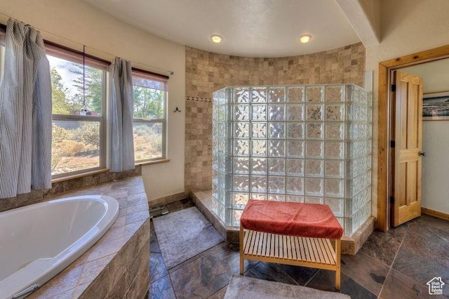 431 E Coronado Ln, Moab, UT 84532 - full bath with baseboards, stone tile floors, a bath, and a walk in shower