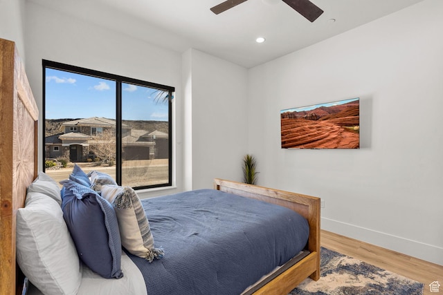 bedroom featuring ceiling fan and hardwood / wood-style floors
