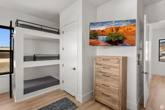 bedroom with light hardwood / wood-style floors