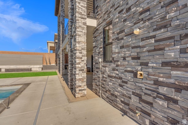view of patio / terrace with an outdoor stone fireplace