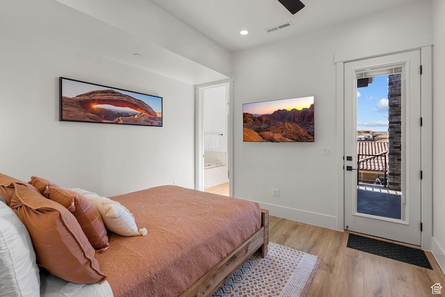 bedroom featuring access to exterior, ensuite bath, ceiling fan, and light wood-type flooring