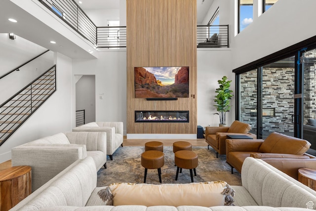 living room featuring a towering ceiling