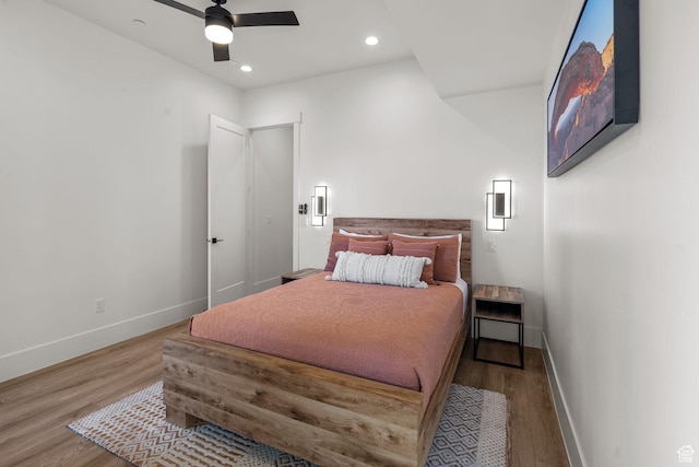 bedroom with wood-type flooring and ceiling fan