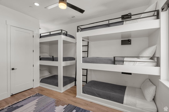 bedroom with hardwood / wood-style flooring and ceiling fan