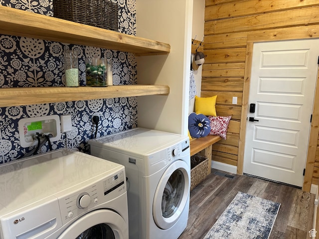 109 Gentle Ben Rd, Fish Haven, ID 83287 - washroom with dark wood finished floors, washing machine and dryer, wooden walls, and laundry area