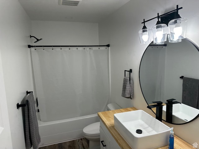 109 Gentle Ben Rd, Fish Haven, ID 83287 - bathroom with toilet, visible vents, shower / tub combo with curtain, wood finished floors, and vanity
