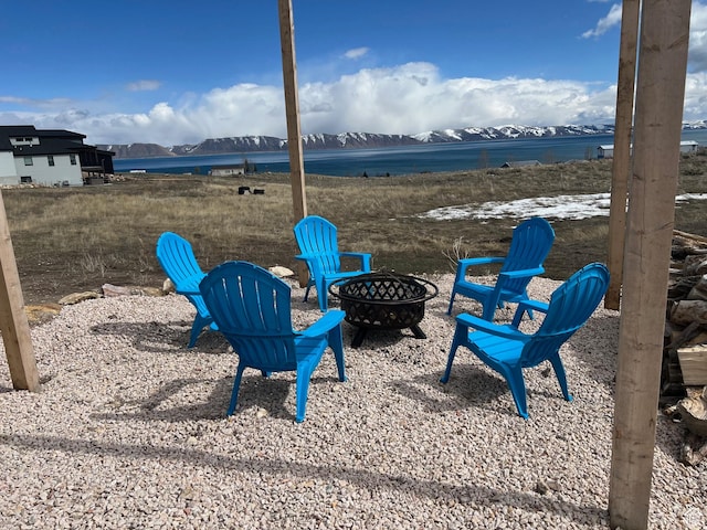 109 Gentle Ben Rd, Fish Haven, ID 83287 - view of yard with an outdoor fire pit and a water and mountain view