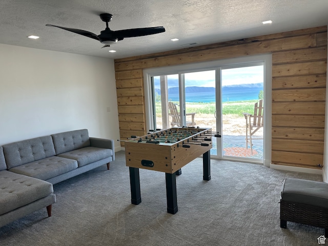 109 Gentle Ben Rd, Fish Haven, ID 83287 - game room with wood walls, a textured ceiling, carpet floors, and recessed lighting