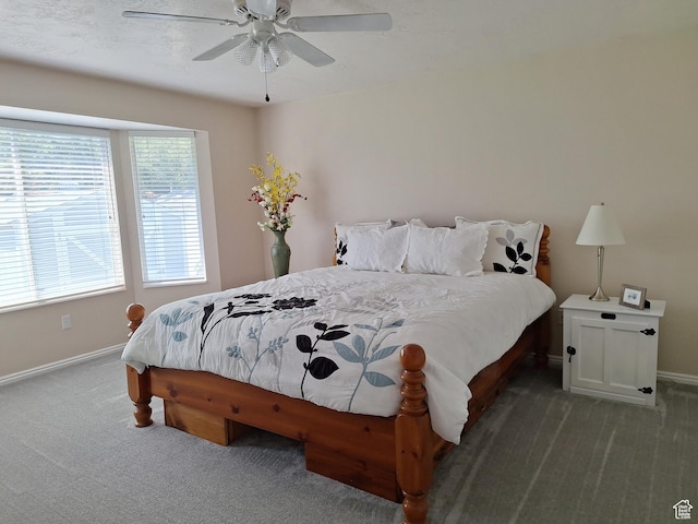 bedroom with baseboards, carpet floors, and a ceiling fan