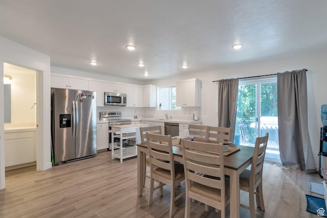 621 Plum Creek Ln, Ogden, UT 84404 - dining area with recessed lighting and light wood-type flooring