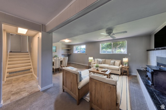 414 W Park Dr W Unit 14, Moab, UT 84532 - living area with stairway, baseboards, carpet floors, ceiling fan, and a fireplace