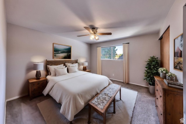 414 W Park Dr W Unit 14, Moab, UT 84532 - bedroom with baseboards, ceiling fan, and light carpet